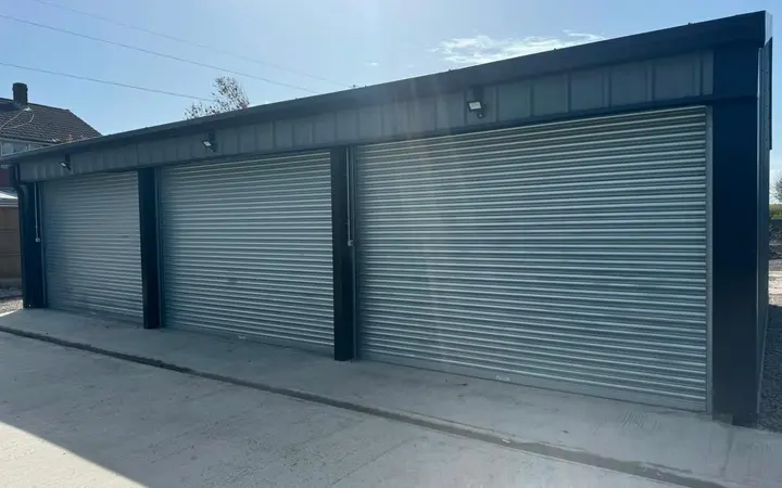 Galvanised roller shutters fitted to a block of garages