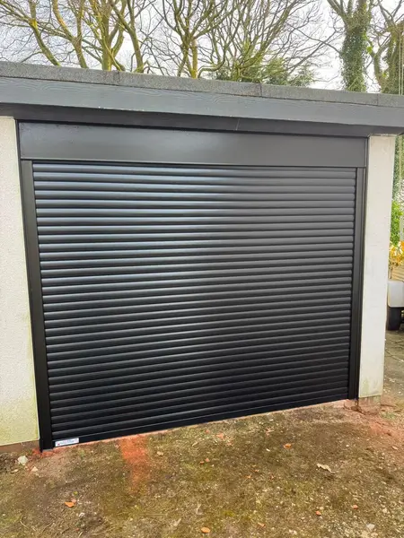 New black insulated roller shutter fitted to the garage