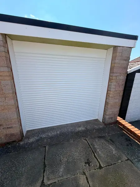 White insulated roller shutter fitted to a domestic garage
