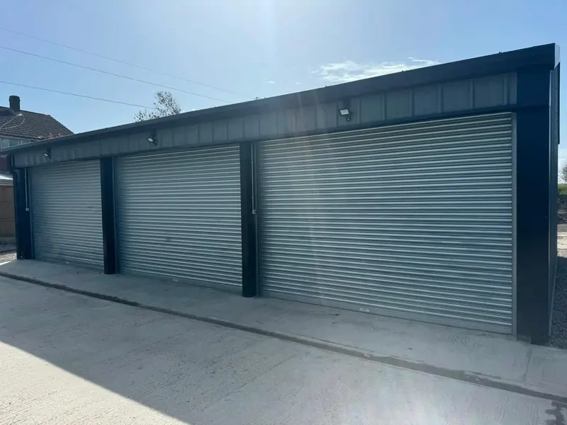 Galvanised roller shutters fitted to a block of garages
