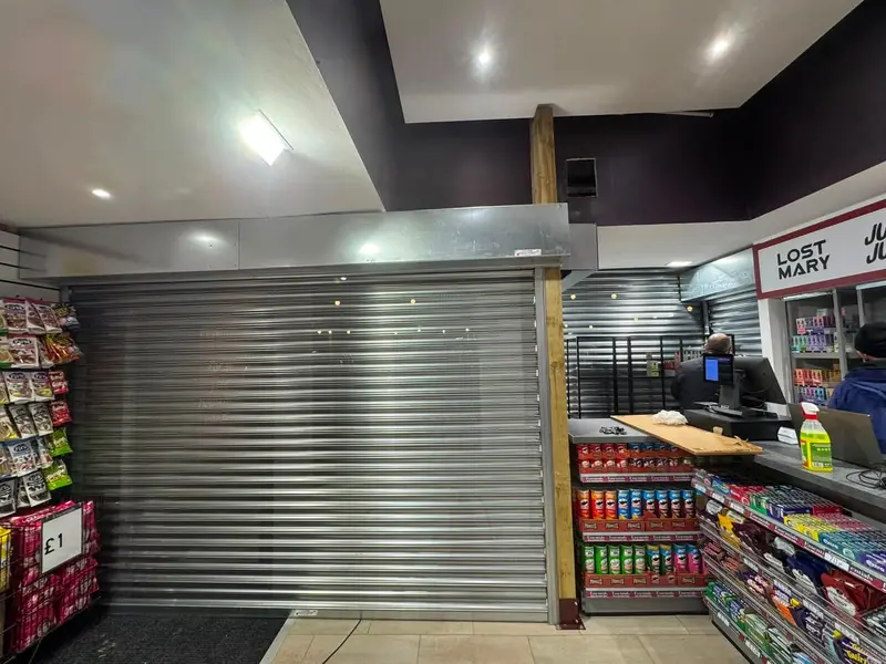 Security shutter protecting a convenience-store counter