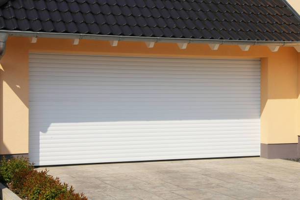 White roller garage door on a rendered home
